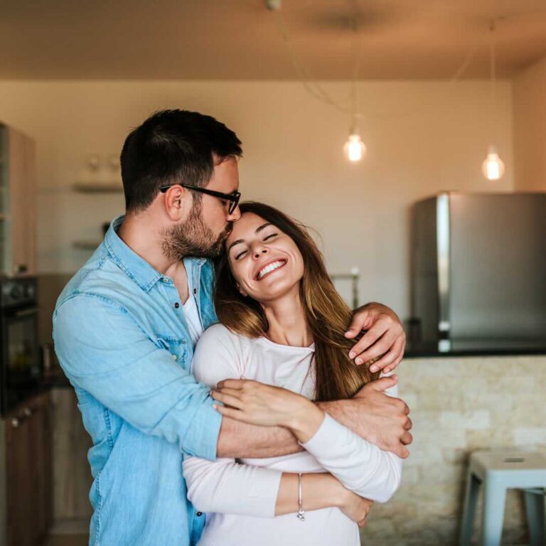 Loving couple in their new apartment.